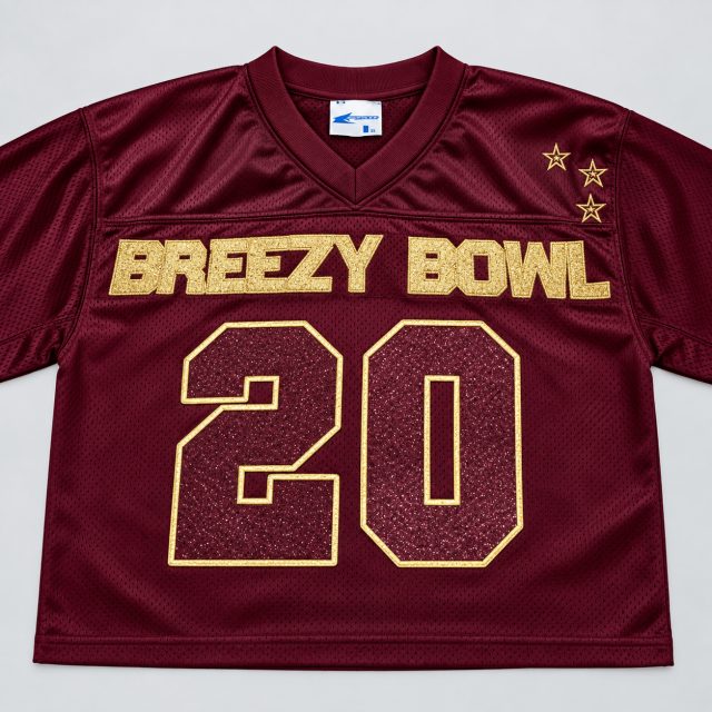 Maroon custom jersey with gold Breezy Bowl lettering
