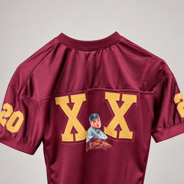 Back of a custom maroon jersey with gold lettering and a photo print